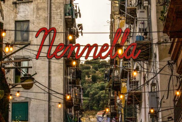 neon over narrow street in town